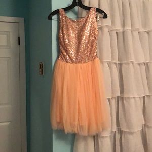 Peachy pink colored formal dress